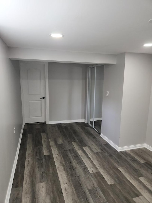 939 W 123rd St, Calumet Park, IL 60827 - unfurnished bedroom featuring dark wood finished floors, baseboards, recessed lighting, and a closet