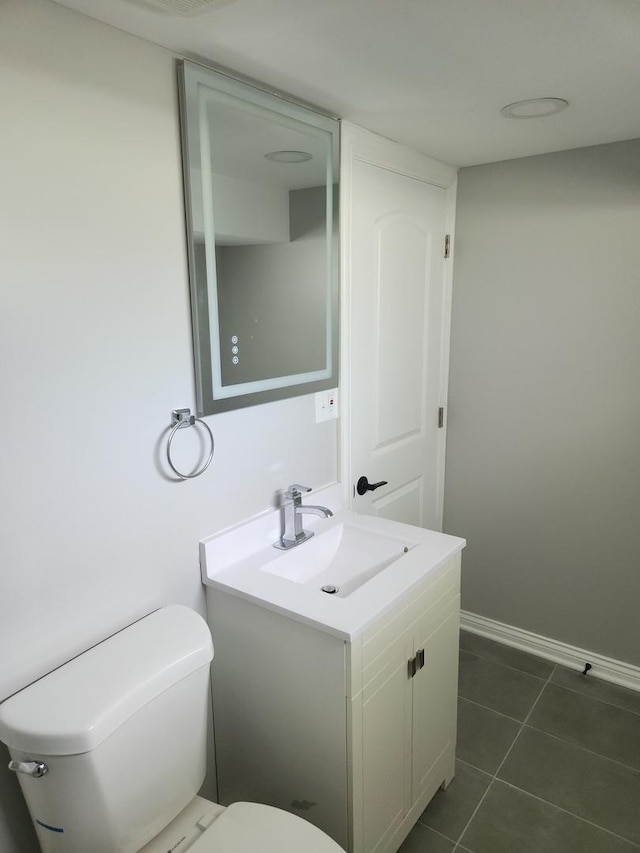 939 W 123rd St, Calumet Park, IL 60827 - bathroom with toilet, vanity, tile patterned floors, and baseboards