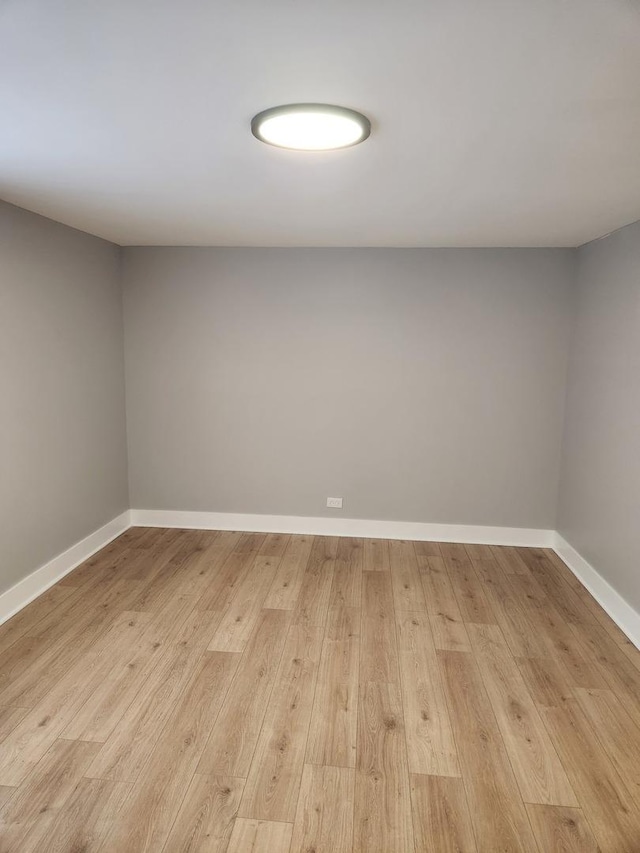 939 W 123rd St, Calumet Park, IL 60827 - unfurnished room with light wood finished floors and baseboards