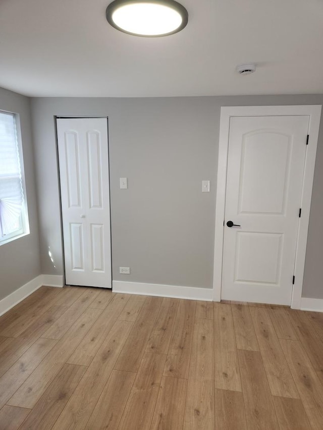 939 W 123rd St, Calumet Park, IL 60827 - empty room with light wood-type flooring and baseboards