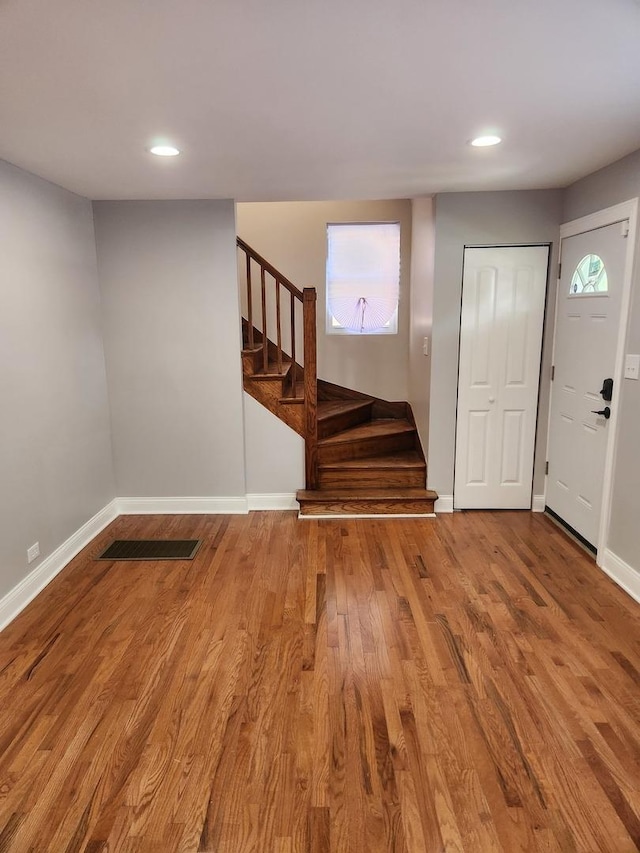 939 W 123rd St, Calumet Park, IL 60827 - foyer entrance featuring stairs, baseboards, wood finished floors, plenty of natural light, and recessed lighting