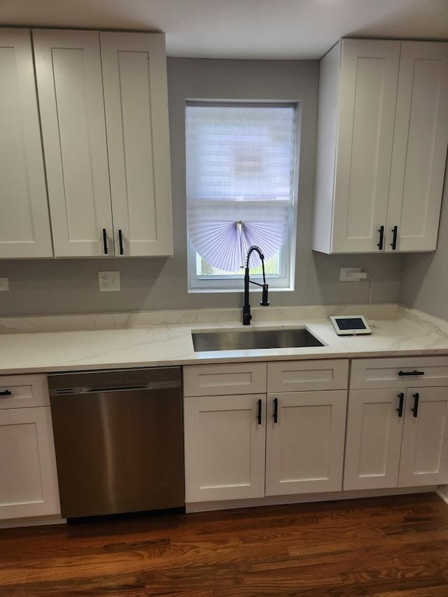 939 W 123rd St, Calumet Park, IL 60827 - kitchen with stainless steel dishwasher, a sink, and white cabinets