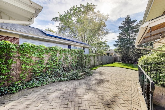 view of patio / terrace featuring fence
