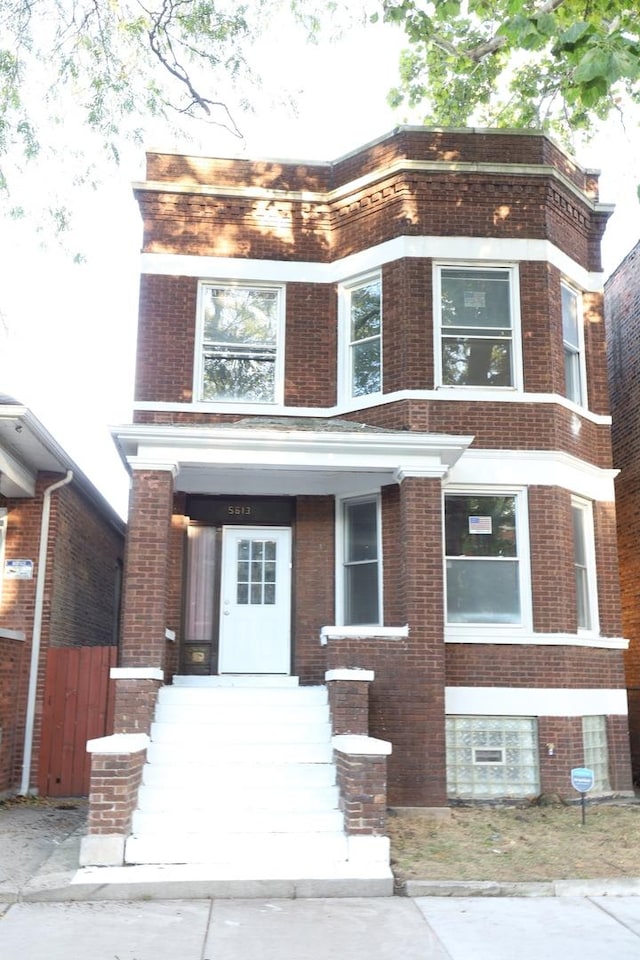 5613 S Wood St, Chicago, IL 60636 - view of front of home with brick siding and fence