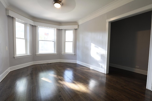 5613 S Wood St, Chicago, IL 60636 - empty room with a ceiling fan, dark wood finished floors, baseboards, and crown molding