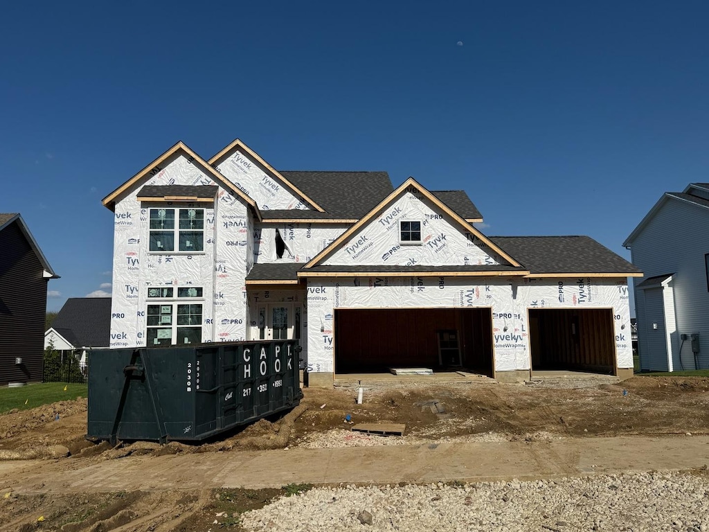 1216 Briarwood Ln, Mahomet, IL 61853 - unfinished property with an attached garage and dirt driveway