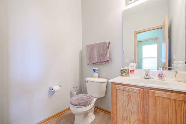 10941 Preston Pkwy, Huntley, IL 60142 - bathroom with toilet, vanity, baseboards, and tile patterned floors