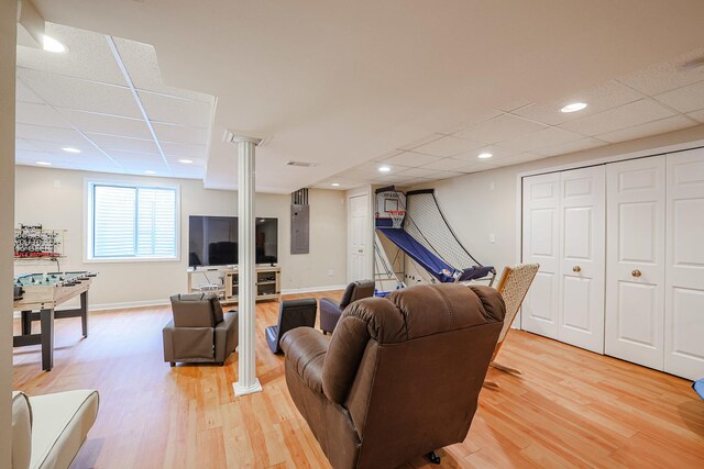 10941 Preston Pkwy, Huntley, IL 60142 - living room with light wood-style flooring, baseboards, and a paneled ceiling