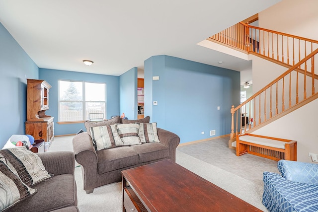 10941 Preston Pkwy, Huntley, IL 60142 - living area with stairway, carpet, baseboards, and ceiling fan