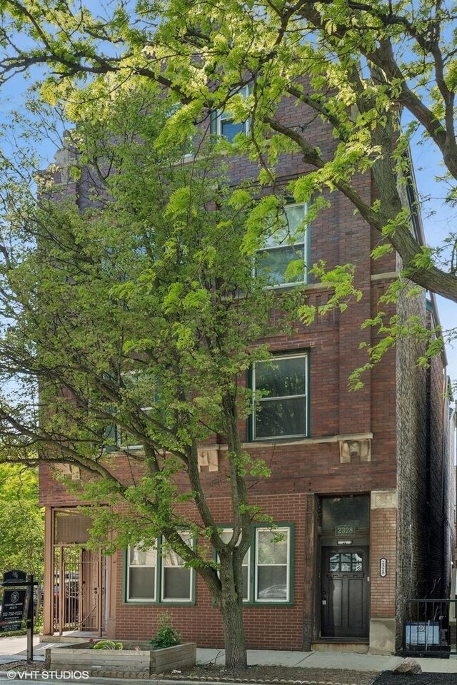 2328 N Oakley Ave Unit 2E, Chicago, IL 60647 - view of front of house with brick siding