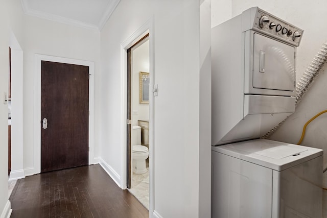 2328 N Oakley Ave Unit 2E, Chicago, IL 60647 - laundry area with stacked washer / drying machine, dark wood finished floors, ornamental molding, and baseboards