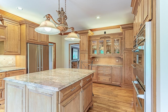25410 N Cayuga Trl, Lake Barrington, IL 60010 - kitchen with built in fridge, decorative backsplash, light stone counters, light wood-type flooring, and recessed lighting