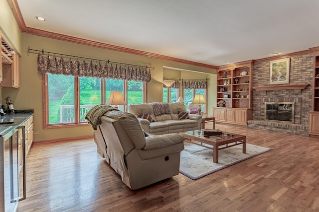 25410 N Cayuga Trl, Lake Barrington, IL 60010 - living area featuring a fireplace, ornamental molding, light wood-style flooring, baseboards, and built in shelves