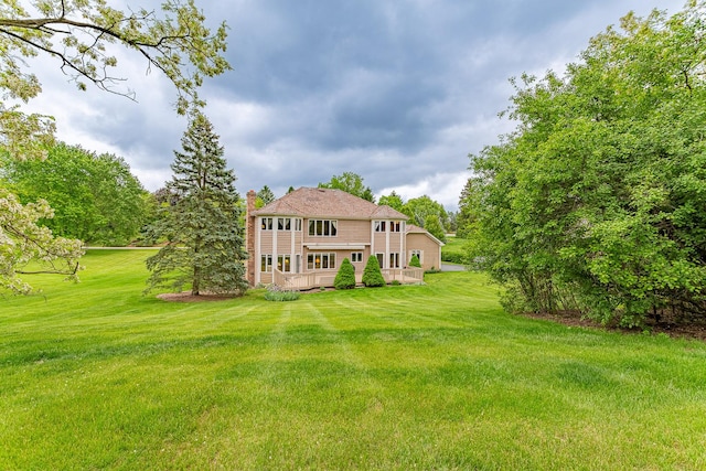 25410 N Cayuga Trl, Lake Barrington, IL 60010 - rear view of property featuring a chimney, a yard, and a wooden deck