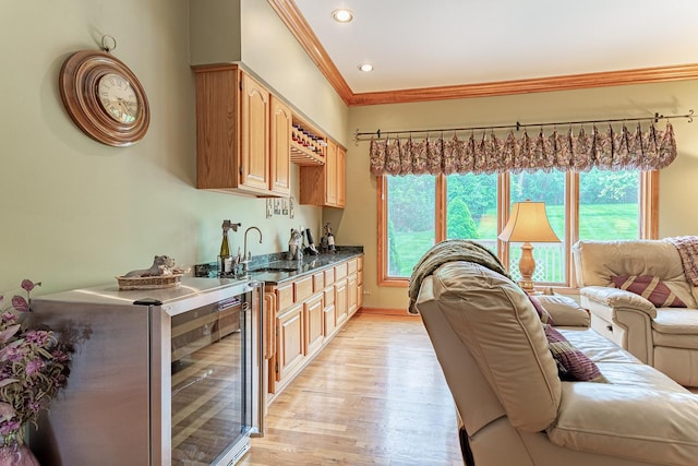 25410 N Cayuga Trl, Lake Barrington, IL 60010 - kitchen featuring a sink, healthy amount of natural light, crown molding, light wood finished floors, and dark countertops