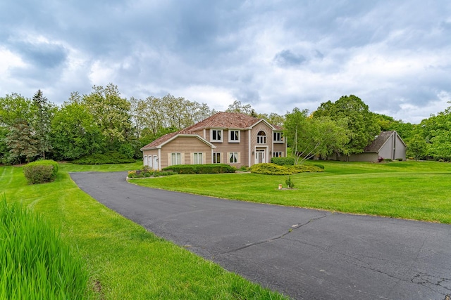 25410 N Cayuga Trl, Lake Barrington, IL 60010 - colonial home featuring driveway, a front lawn, and an attached garage