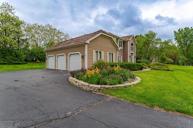 25410 N Cayuga Trl, Lake Barrington, IL 60010 - view of home's exterior featuring a lawn, driveway, and a garage