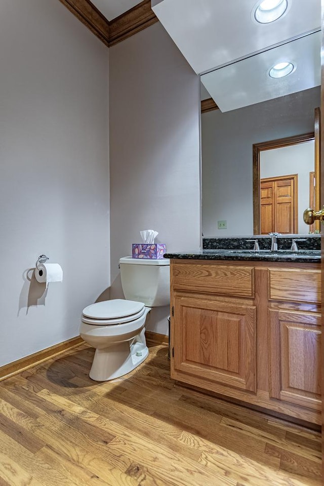 25410 N Cayuga Trl, Lake Barrington, IL 60010 - half bath featuring toilet, ornamental molding, wood finished floors, vanity, and baseboards