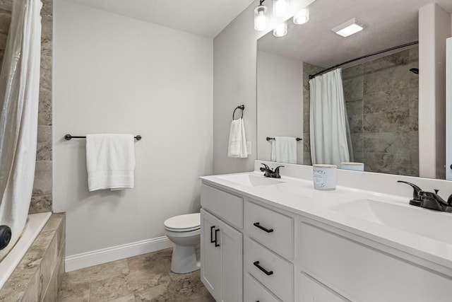 2011 Medical Center Dr, Monticello, IL 61856 - bathroom featuring toilet, baseboards, and double vanity
