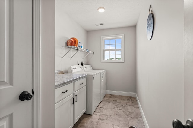 2011 Medical Center Dr, Monticello, IL 61856 - laundry room featuring washing machine and clothes dryer, baseboards, and cabinet space