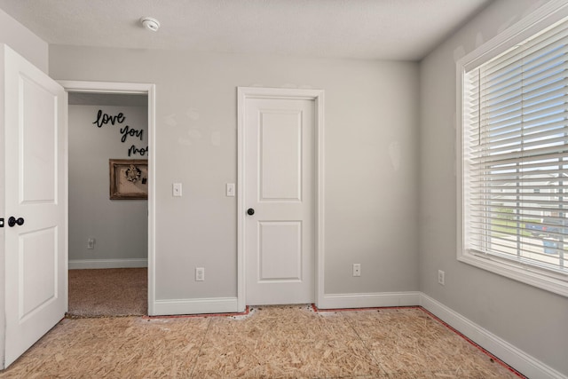 2011 Medical Center Dr, Monticello, IL 61856 - unfurnished bedroom featuring baseboards