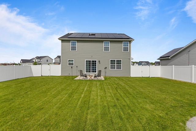 2011 Medical Center Dr, Monticello, IL 61856 - back of house with roof mounted solar panels and a patio