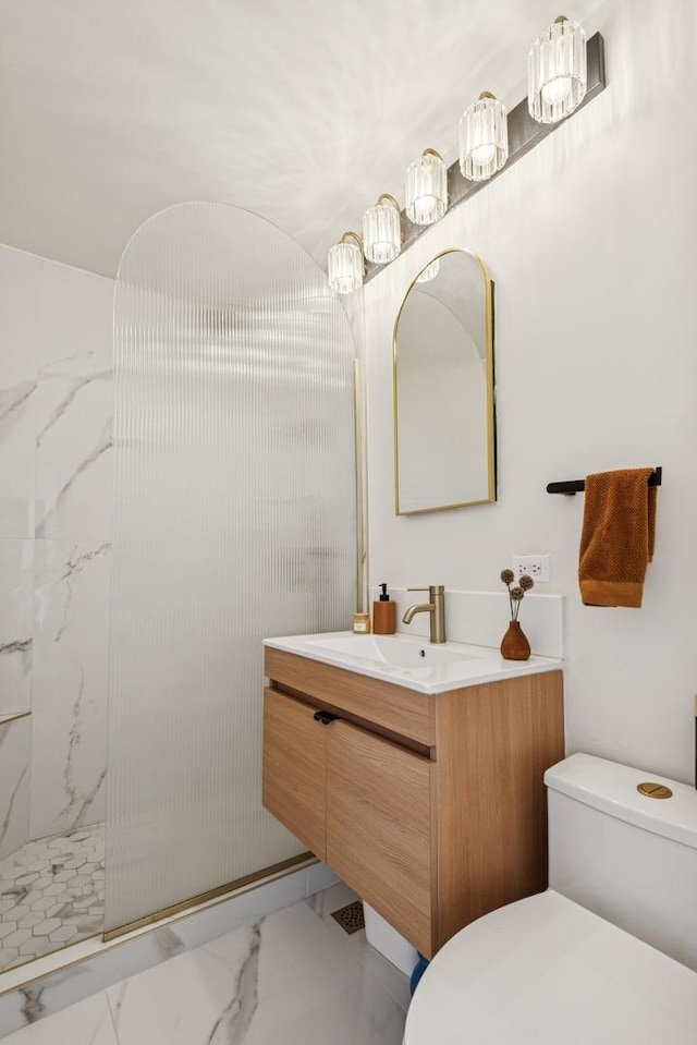6301 N Sheridan Rd Unit 17J, Chicago, IL 60660 - full bath featuring marble finish floors, toilet, vanity, walk in shower, and a chandelier