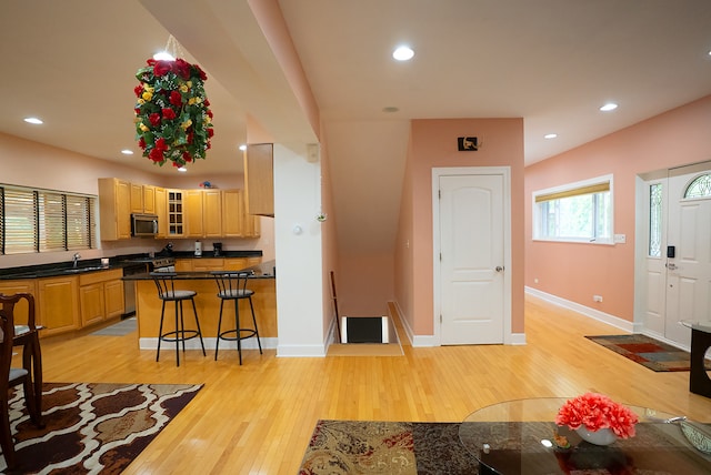 4310 Church St, Skokie, IL 60076 - living area with light wood-type flooring, baseboards, and recessed lighting