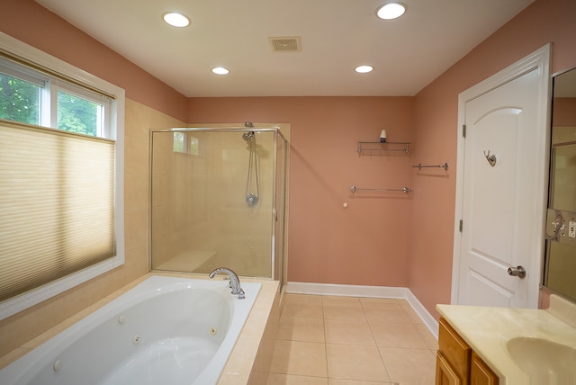 4310 Church St, Skokie, IL 60076 - bathroom with a jetted tub, a shower stall, vanity, tile patterned flooring, and recessed lighting