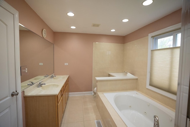 4310 Church St, Skokie, IL 60076 - bathroom featuring a tub with jets, tile patterned floors, double vanity, recessed lighting, and toilet