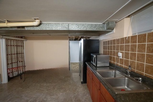 4310 Church St, Skokie, IL 60076 - below grade area featuring a sink and freestanding refrigerator