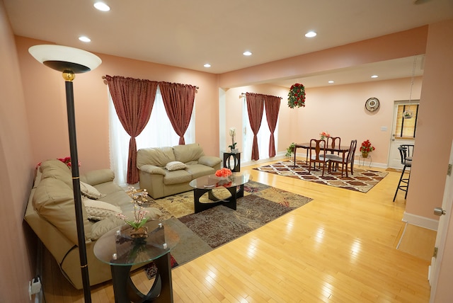 4310 Church St, Skokie, IL 60076 - living room featuring recessed lighting, wood finished floors, plenty of natural light, and baseboards