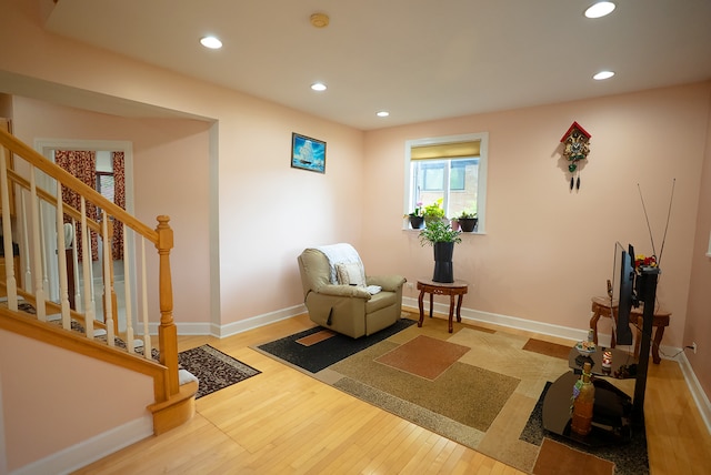 4310 Church St, Skokie, IL 60076 - living area with wood-type flooring, recessed lighting, baseboards, and stairway