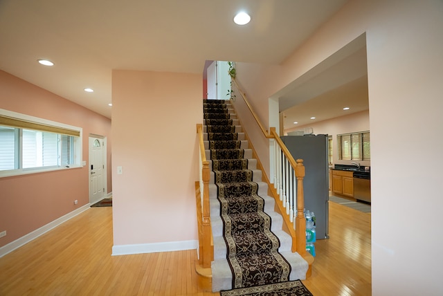4310 Church St, Skokie, IL 60076 - stairway featuring wood finished floors, baseboards, and recessed lighting