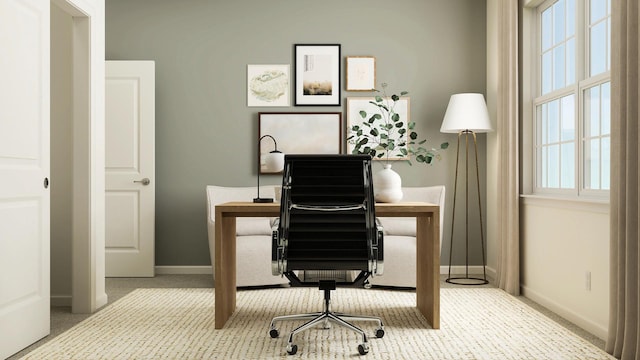 carpeted office space with baseboards