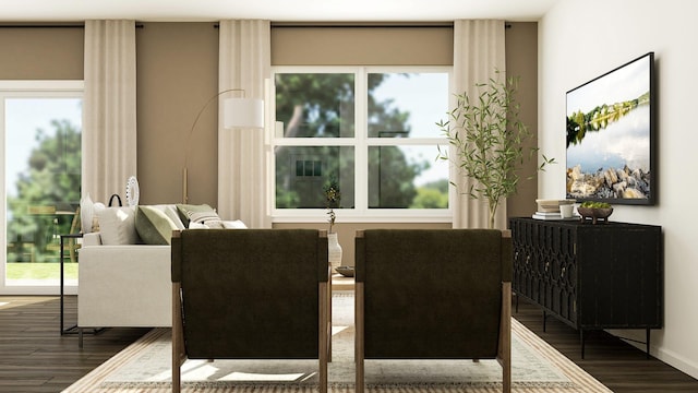 dining space featuring dark wood-style flooring, healthy amount of natural light, and baseboards