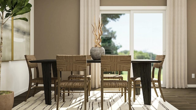 dining space with baseboards, wood finished floors, and healthy amount of natural light