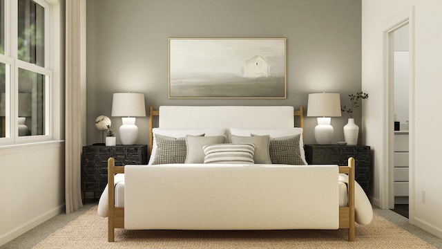 carpeted bedroom with baseboards