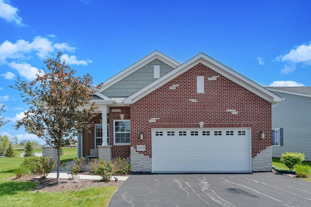 25549 Sara Ct, Channahon, IL 60410 - traditional-style home featuring asphalt driveway, a garage, stone siding, and brick siding