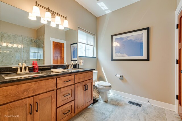 25549 Sara Ct, Channahon, IL 60410 - full bathroom with a stall shower, toilet, baseboards, and double vanity