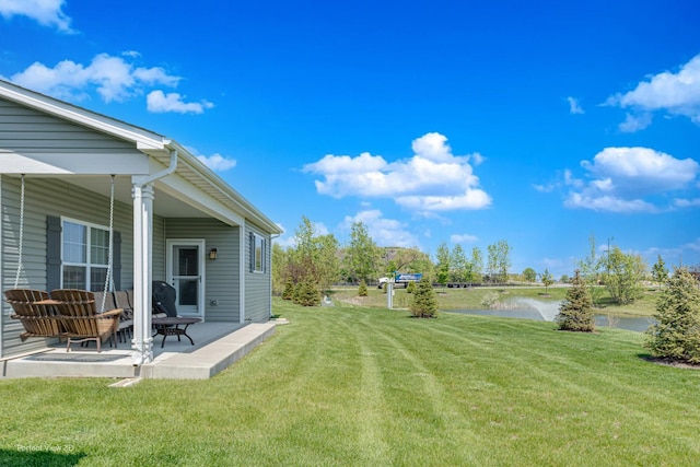 25549 Sara Ct, Channahon, IL 60410 - view of grassy yard featuring a water view and a patio area