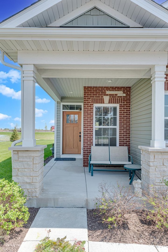 25549 Sara Ct, Channahon, IL 60410 - entrance to property featuring covered porch and brick siding