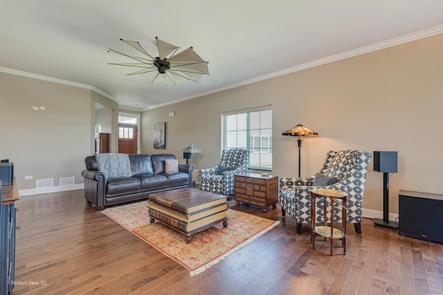 25549 Sara Ct, Channahon, IL 60410 - living room with healthy amount of natural light, ornamental molding, hardwood / wood-style floors, baseboards, and a ceiling fan