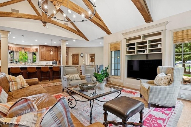 41W590 Bowgren Dr, Campton Hills, IL 60119 - living area with ornate columns, recessed lighting, beamed ceiling, light wood-type flooring, and high vaulted ceiling