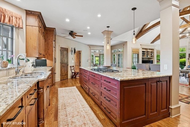 41W590 Bowgren Dr, Campton Hills, IL 60119 - kitchen featuring a sink, stainless steel gas stovetop, light wood-style flooring, plenty of natural light, and recessed lighting