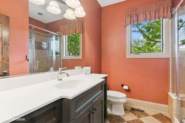 41W590 Bowgren Dr, Campton Hills, IL 60119 - full bathroom featuring vanity, toilet, a shower stall, and baseboards