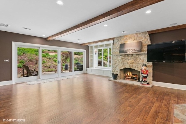 41W590 Bowgren Dr, Campton Hills, IL 60119 - unfurnished living room with wood finished floors, a stone fireplace, beamed ceiling, recessed lighting, and baseboards