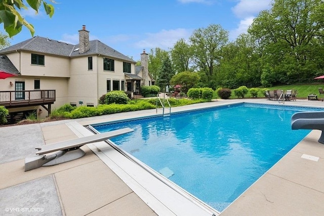 41W590 Bowgren Dr, Campton Hills, IL 60119 - outdoor pool with a water slide, a diving board, and a patio