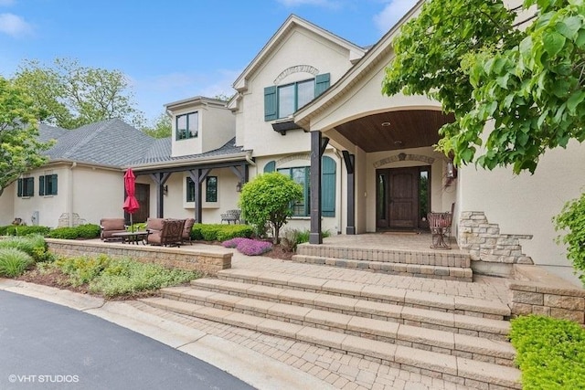 41W590 Bowgren Dr, Campton Hills, IL 60119 - view of front of house with stucco siding and covered porch