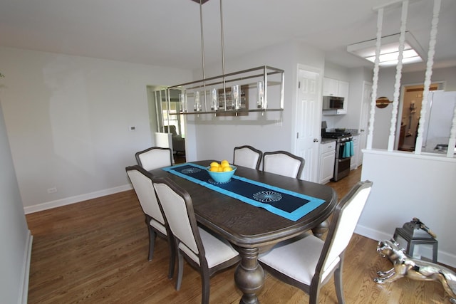1188 Cypress Ln, Elk Grove Village, IL 60007 - dining area featuring dark wood-style floors and baseboards
